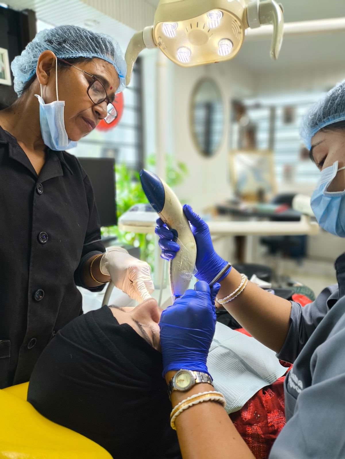 Skin doctor treating a patient with laser therapy in Kolkata